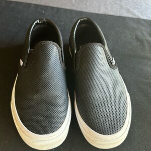 Women’s black leather vans